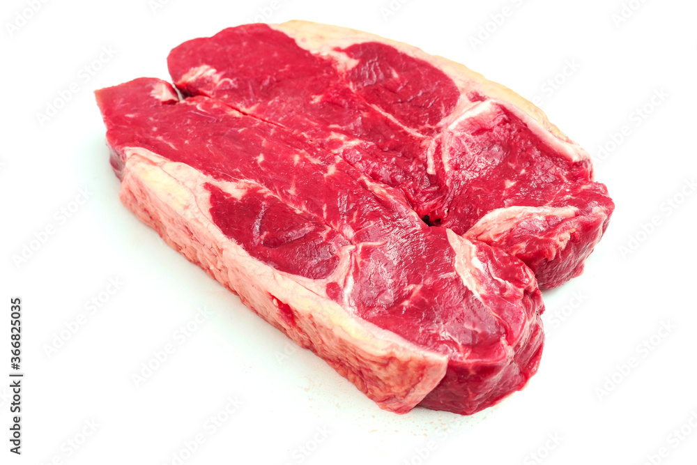 Two fresh strip loin steaks on a white isolated background. Meat industry product.