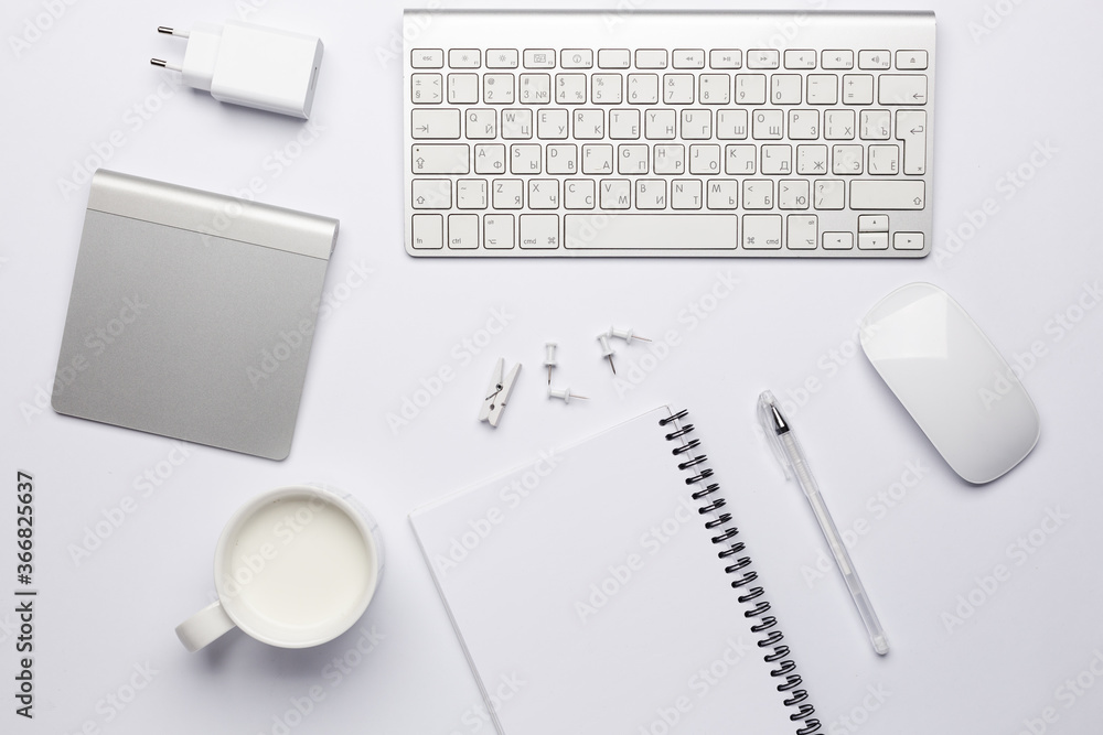 Empty white notebook with pen, working place with keyboard. Empty white notebook with pen, working place with keyboard.