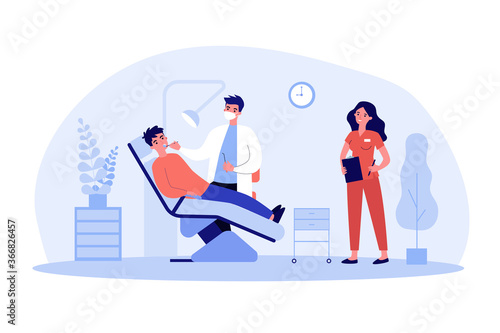 Dentist examining patient with nurse assistance. Man visiting dental clinic, sitting in dentist chair. Vector illustration for teeth treatment, healthcare, dental care, stomatology concepts