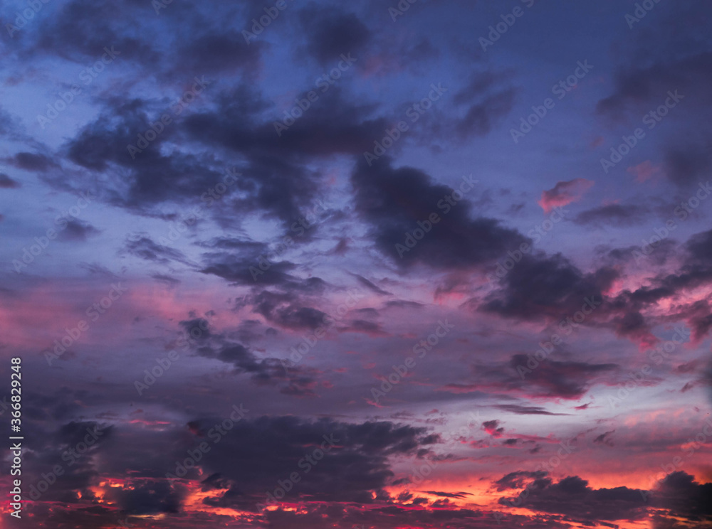 Beautiful sky at sunset in the evening. Rich colors, clouds.