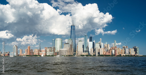 Panorama on manhattan skyline from hudson river with blue sky and summer cloud