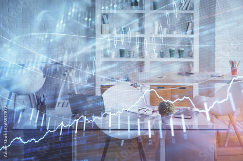 Double exposure of financial graph drawing and office interior background. Concept of stock market.