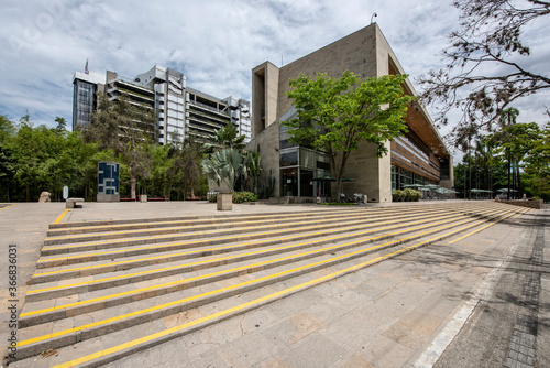 Medellin, Antioquia, Colombia. May 26, 2020: Pies descalzos park, Liberty Building and EPM Smart Building. Blue sky and trees. photo