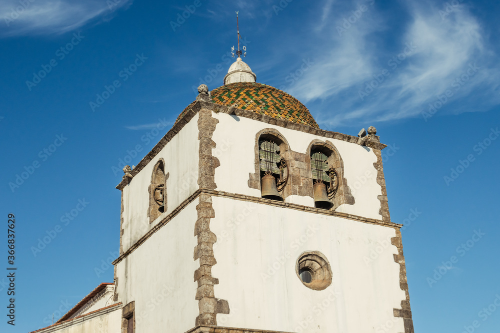 Detail of the facade and singular dome of the bell tower with its arches of the Mother Church of Pedrogão Grande PORTUGAL