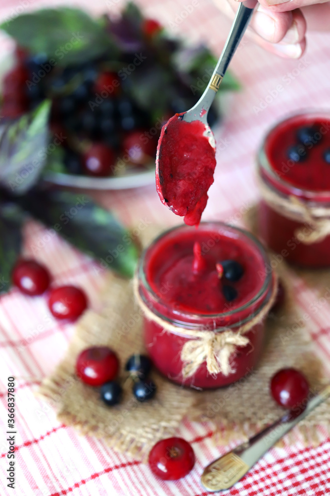 Selective focus. Detox smoothie with cherries and black currants. Smoothie with berries and basil. Vegan diet. Fresh homemade smoothie. Healthy summer dessert. Selective focus. Detox smoothie with cherries and black currants. Smoothie with berries and basil. Vegan diet. Fresh homemade smoothie. Healthy summer dessert.