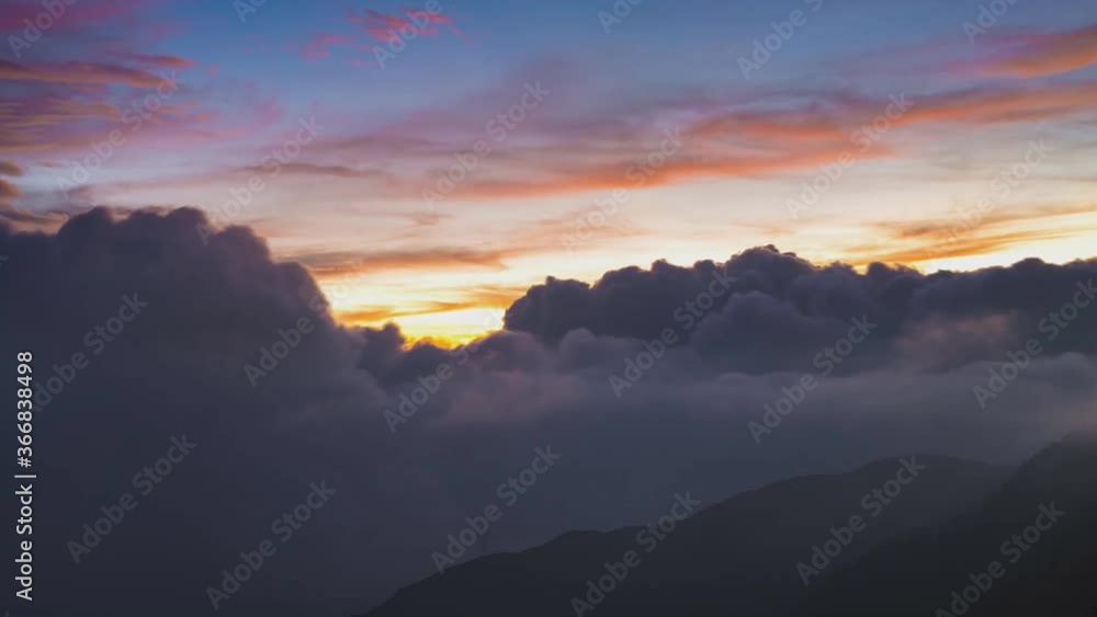 Dramatic clouds beautiful view from the mountain to sunset and floating clouds, Taiwan, Asia. (time-lapse) Dramatic clouds beautiful view from the mountain to sunset and floating clouds, Taiwan, Asia. (time-lapse)
