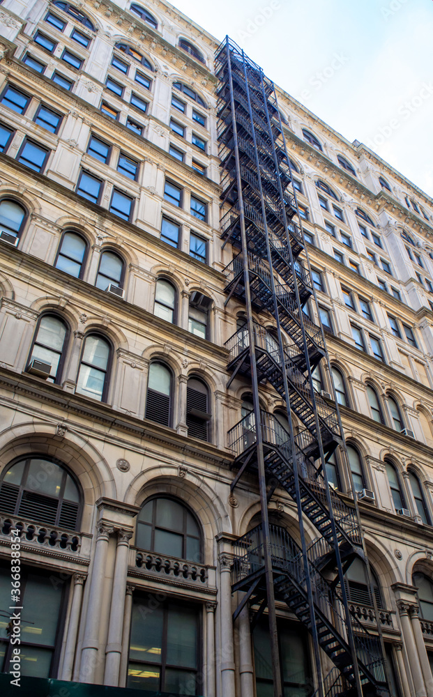 classic New York City facade with fire escapes