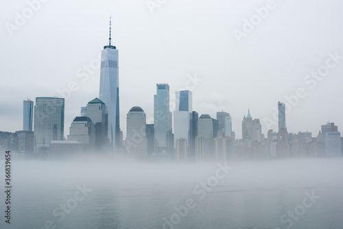 Freedom Tower and New York skyline on a foggy  misty day.