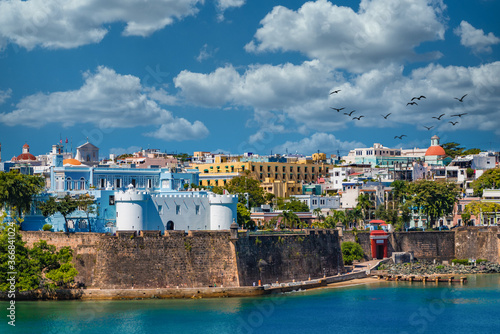 Colorful, historical buildings on the coast of Old San Juan, Puerto Rico photo