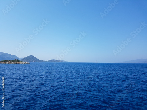 mountains by the sea, mountain ranges and rocks, seascapes, blue sky © Serhii Photography