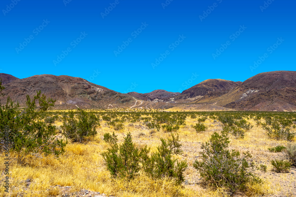 Mountain range in the Mojave Desert near Yermo, California, on a hot summer day with no clouds.