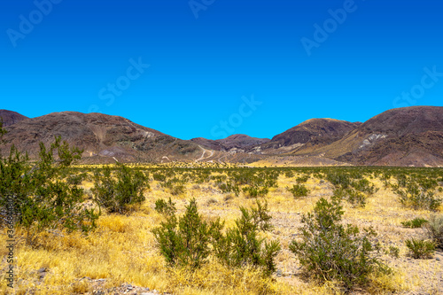 Mountain range in the Mojave Desert near Yermo, California, on a hot summer day with no clouds. © Felipe Sanchez