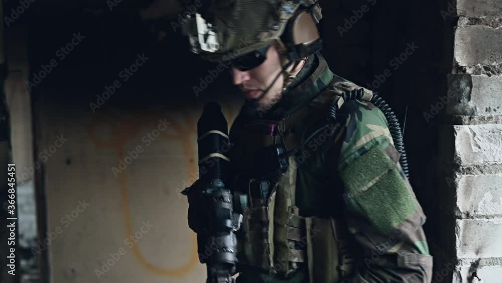 Military men with arms defending the building. Soldier stand guard securing territory looking around. Military men with arms defending the building. Soldier stand guard securing territory looking around.