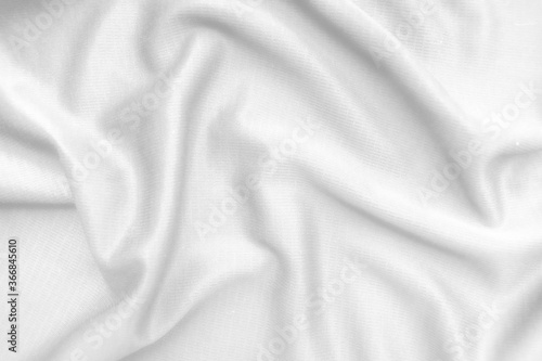 Abstract white fabric texture background. Wavy white cloth.