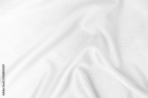 Abstract white fabric texture background. Wavy white cloth.