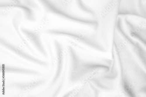 Abstract white fabric texture background. Wavy white cloth.