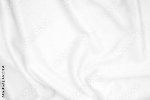 Abstract white fabric texture background. Wavy white cloth.