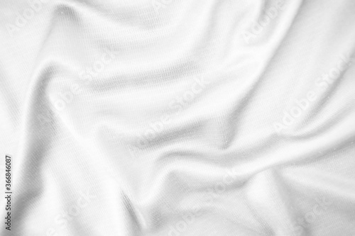 Abstract white fabric texture background. Wavy white cloth.