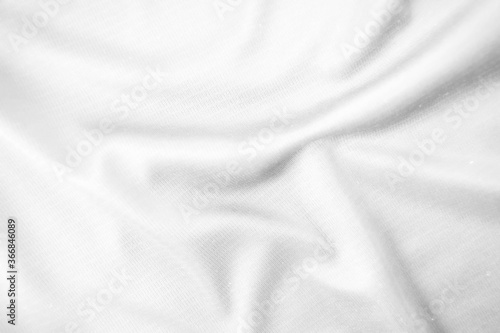 Abstract white fabric texture background. Wavy white cloth.