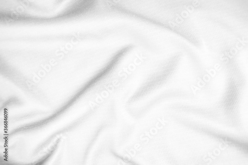 Abstract white fabric texture background. Wavy white cloth.