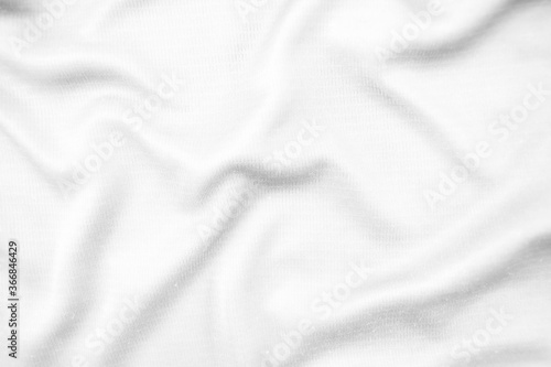 Abstract white fabric texture background. Wavy white cloth.