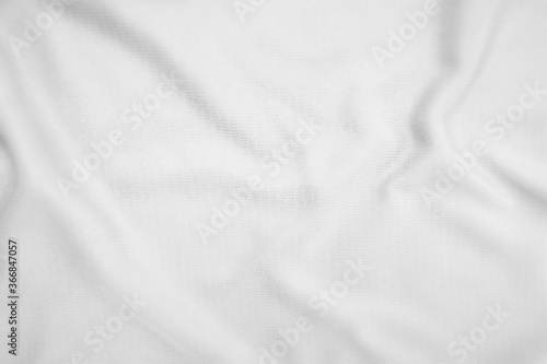 Abstract white fabric texture background. Wavy white cloth.