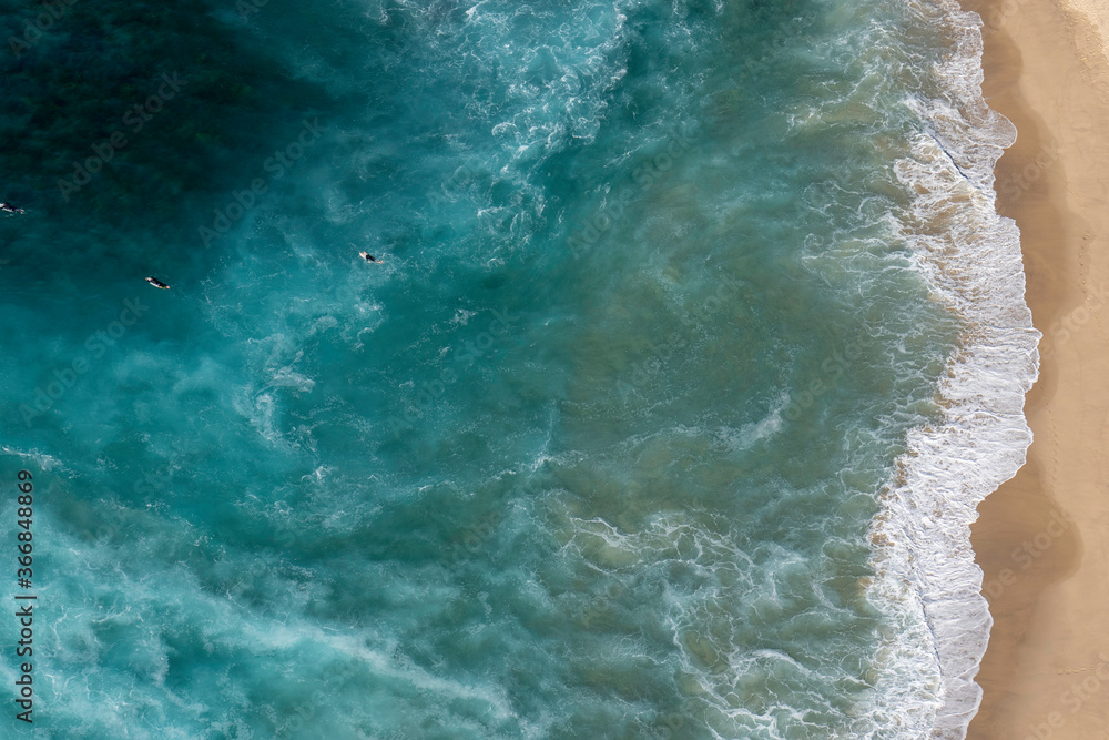 Aerial view of surfers paddling out in a rip at Bronte Beach in Sydney Australia
