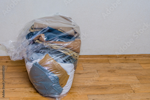 Used clothes in plastic bag