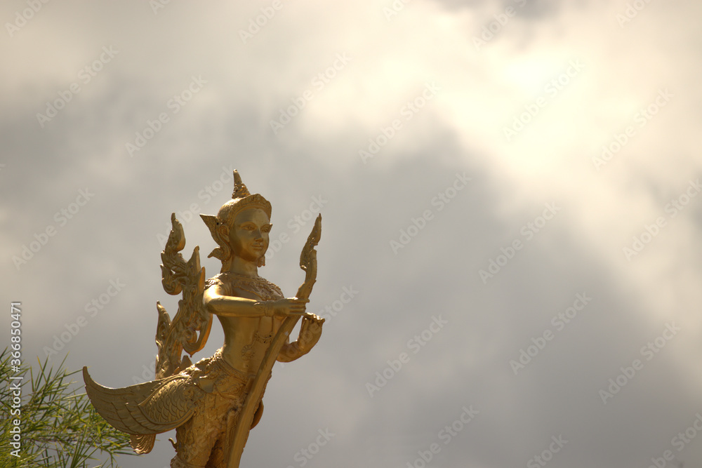 Thai statue isolated on a cloudy background