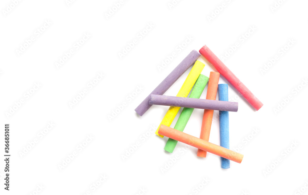 chalks in a variety of colors arranged on a white background chalks in a variety of colors arranged on a white background