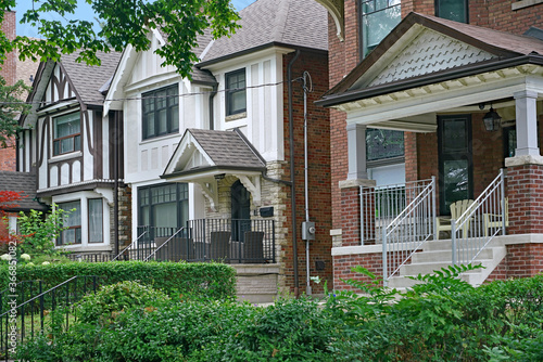 Wallpaper Mural Residential street with large detached brick houses and shady front yards Torontodigital.ca