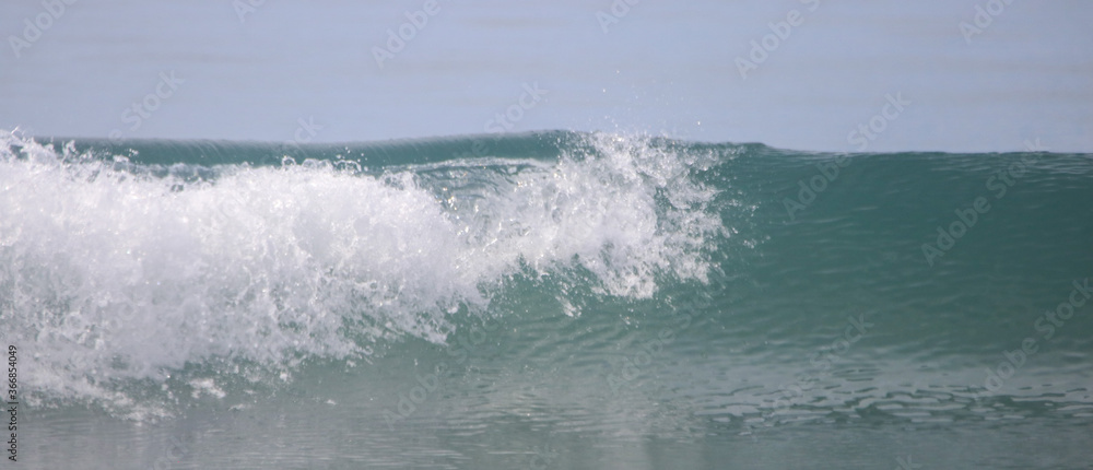 Waves crashing into the ocean