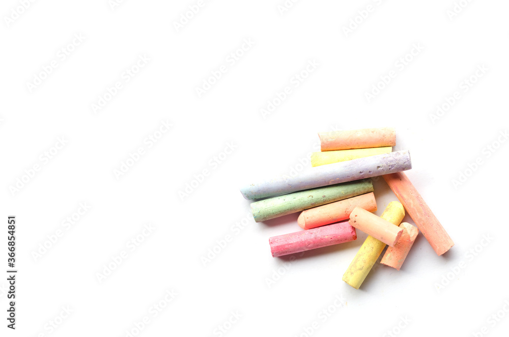 chalks in a variety of colors arranged on a white background chalks in a variety of colors arranged on a white background