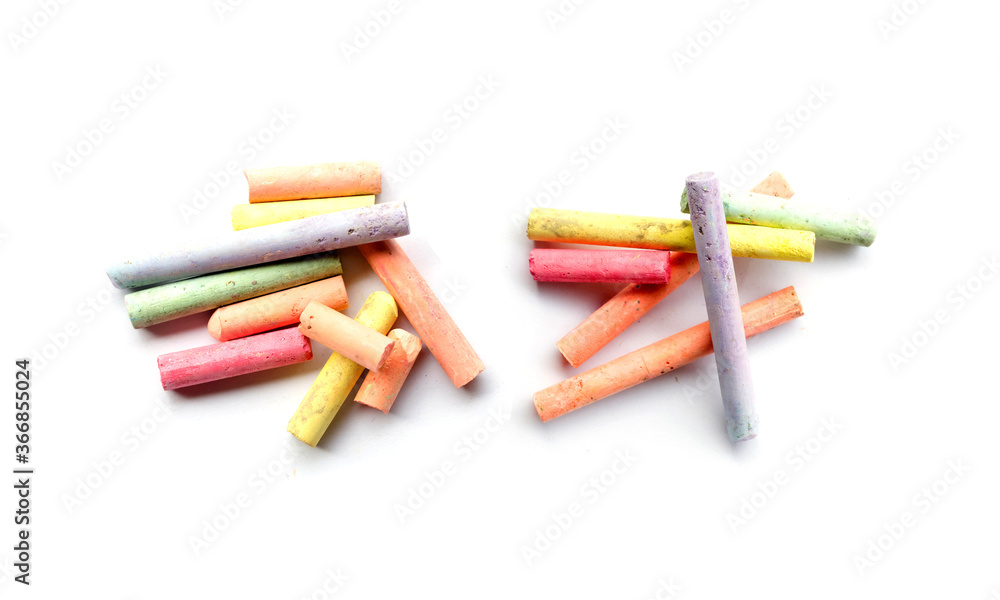 chalks in a variety of colors arranged on a white background chalks in a variety of colors arranged on a white background