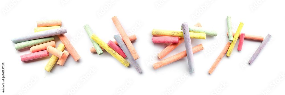 chalks in a variety of colors arranged on a white background chalks in a variety of colors arranged on a white background