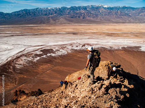 Canyoneers Climb Steep Mountain Above Badwater Basin photo