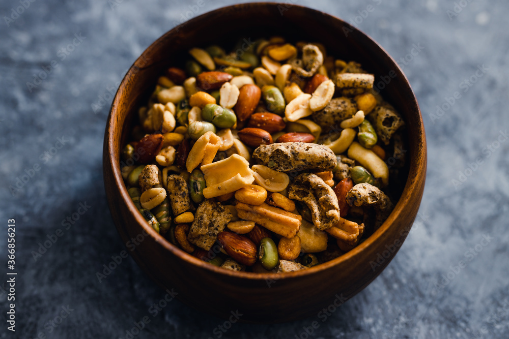 plant-based food, vegan nuts and legumes snack mix in wooden bowl plant-based food, vegan nuts and legumes snack mix in wooden bowl