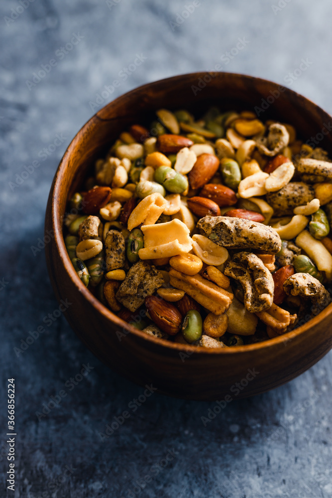 plant-based food, vegan nuts and legumes snack mix in wooden bowl plant-based food, vegan nuts and legumes snack mix in wooden bowl