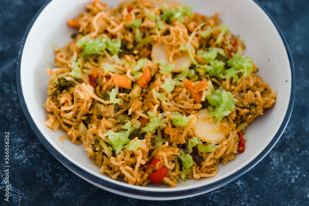 plant-based food, vegan ginger noodles with stir fry vegetables and grated celeri plant-based food, vegan ginger noodles with stir fry vegetables and grated celeri