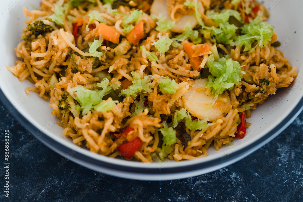 plant-based food, vegan ginger noodles with stir fry vegetables and grated celeri plant-based food, vegan ginger noodles with stir fry vegetables and grated celeri