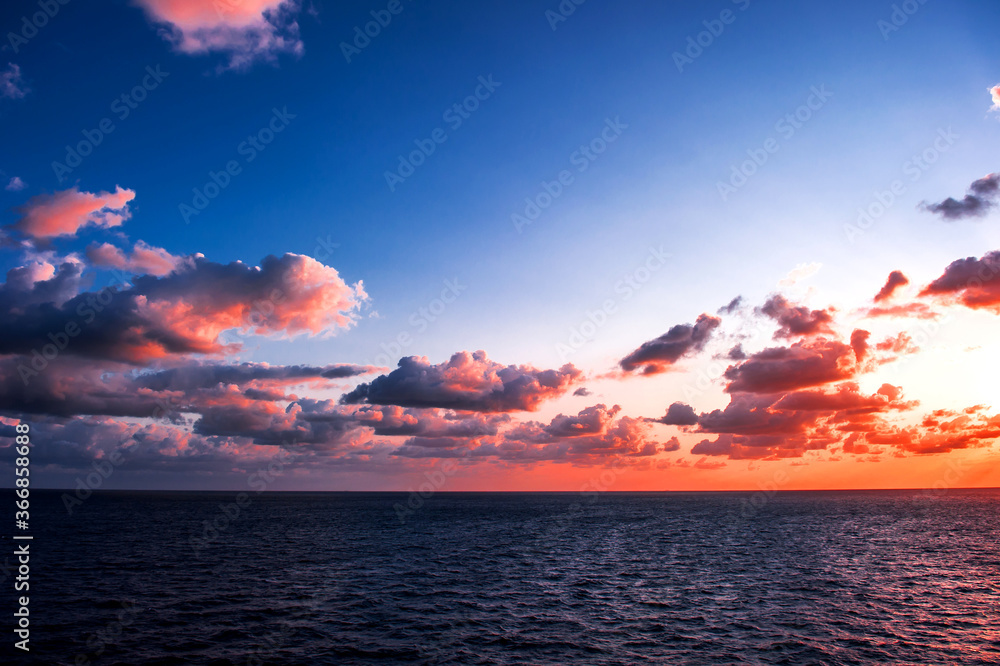 Fototapeta premium The fantastic and wonderful sunset,Caribbean sea with curious clouds.