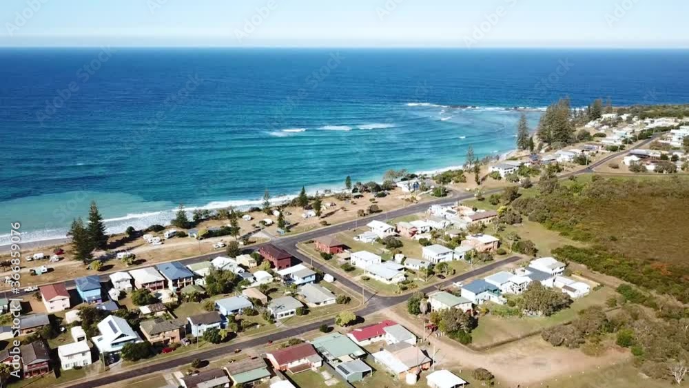 Aerial Drone Above Australian Coastal Town And Beach With Blue Ocean Waves In Summer Aerial Drone Above Australian Coastal Town And Beach With Blue Ocean Waves In Summer