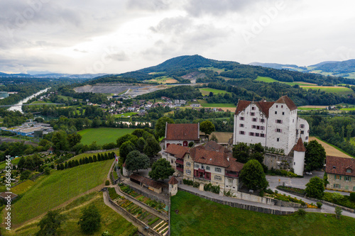 old castle surrounded by meadows and vineyards