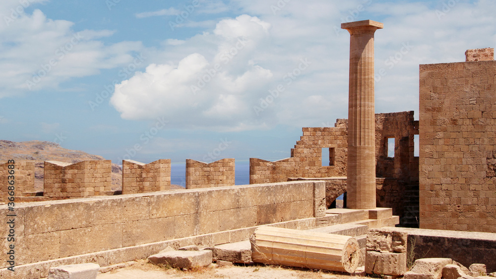 Fototapeta premium Acropolis of Lindos, the ruins of an ancient temple and the remains of the Doric columns. Lindos, Rhodes, Greece 
