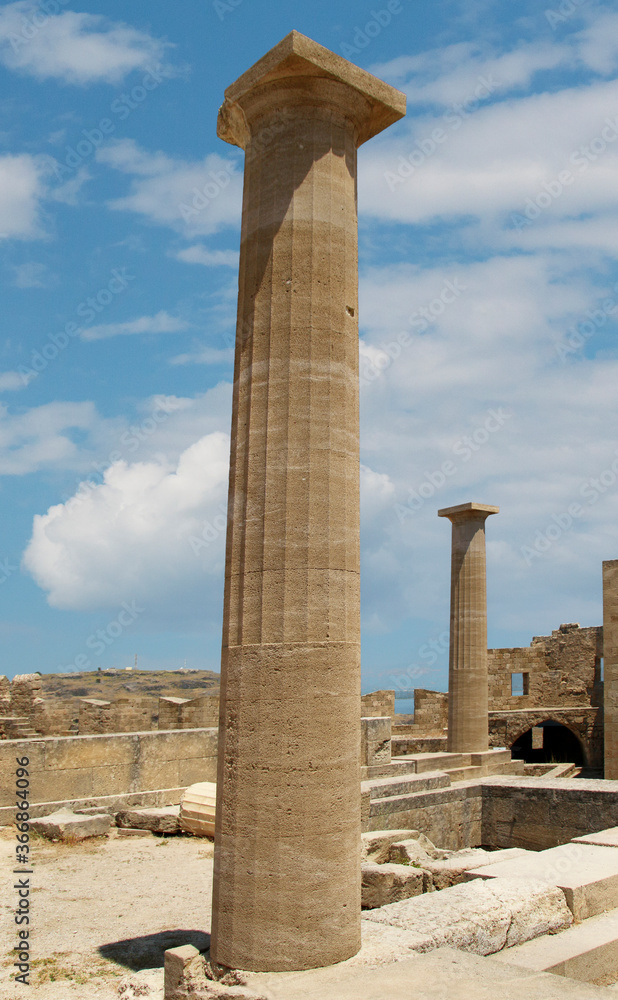 Acropolis of Lindos, the ruins of an ancient temple and the remains of the Doric columns. Lindos, Rhodes, Greece