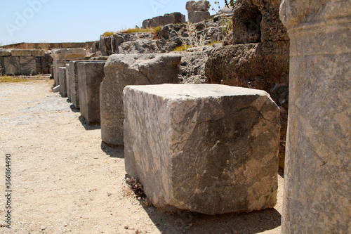 Stone bases of statues, the Acropolis of Lindos, Greece. The dedications in Greek glorify the gods