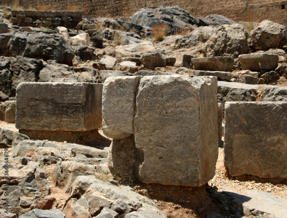 Stone bases of statues, the Acropolis of Lindos, Greece. The