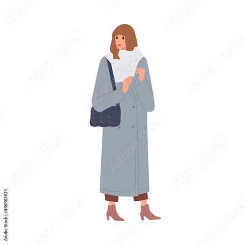 Fashion woman in warm scarf and coat vector flat illustration. Female with ha...