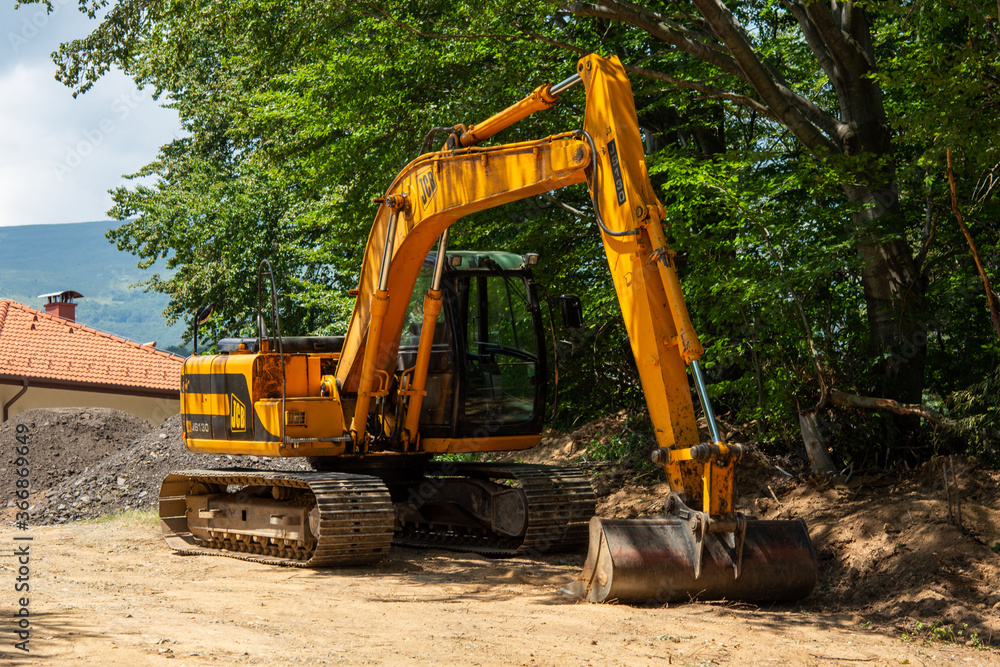 excavator on the construction site excavator on the construction site