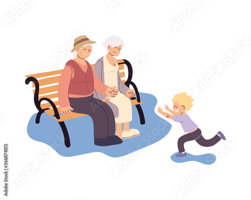 grandparents sitting on bench and grandson together smiling